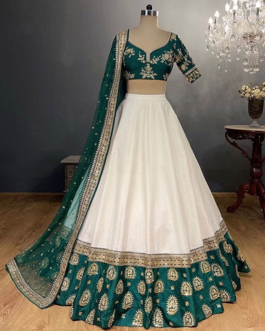 White tapeta silk green border embroidered wedding lehenga choli
