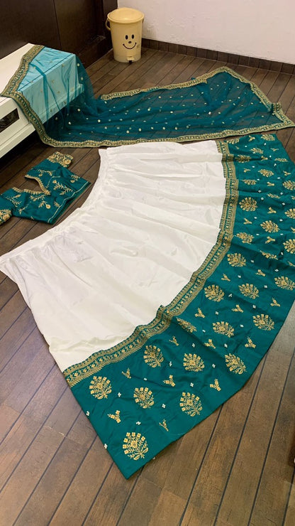 White tapeta silk green border embroidered wedding lehenga choli