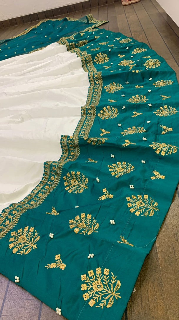 White tapeta silk green border embroidered wedding lehenga choli
