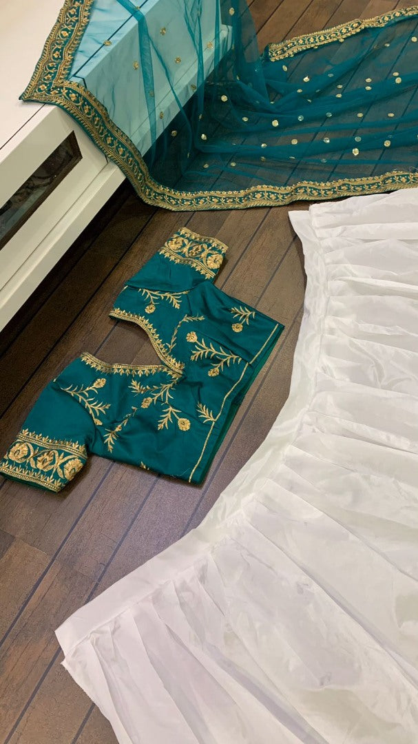 White tapeta silk green border embroidered wedding lehenga choli