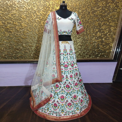 white tapeta silk multicolored heavy threadwork wedding lehenga choli