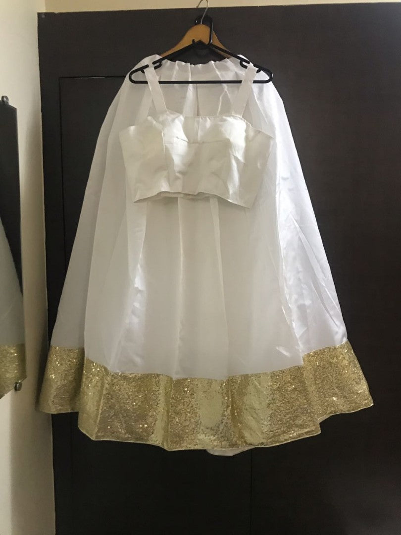 white tapeta silk sequence border partywear lehenga choli