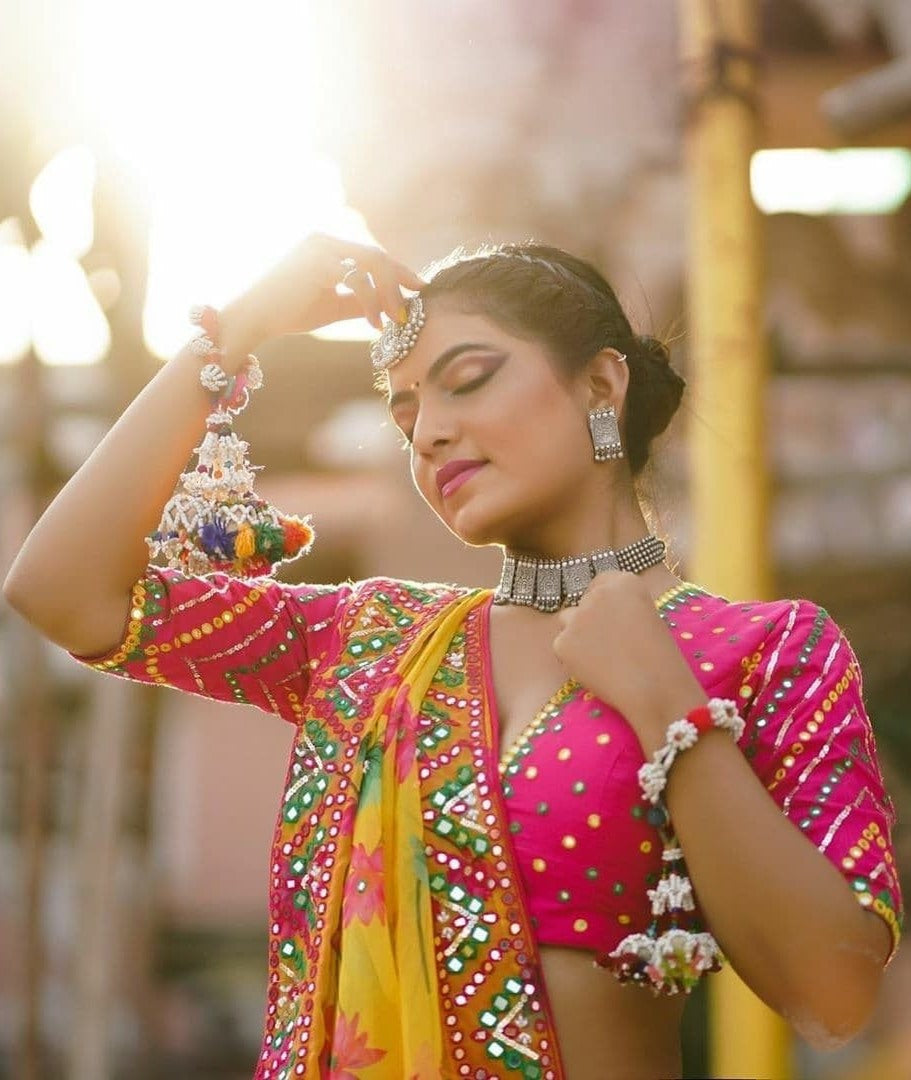 Yellow and pink butter silk print and mirror work navratri lehenga choli