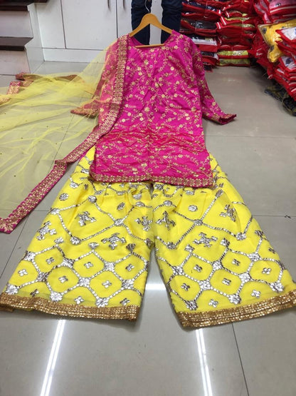 Yellow and pink tapeta silk embroidered plazzo salwar suit