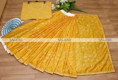 Yellow chinon silk printed paper mirror work border saree