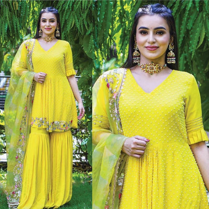 Yellow georgette embroidered and moti work sharara suit