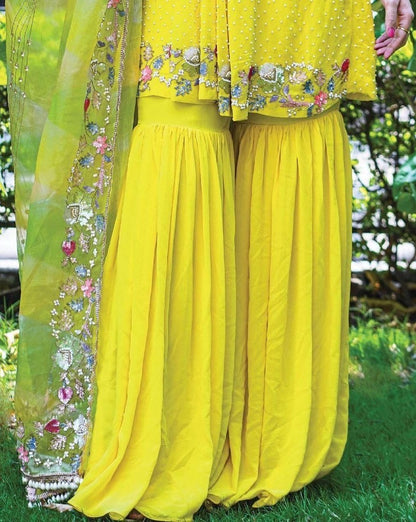 Yellow georgette embroidered and moti work sharara suit