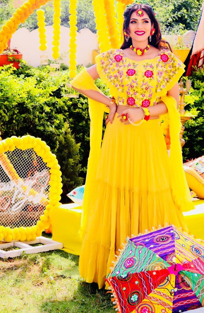 Yellow georgette embroidered ruffle lehenga for haldi ceremony