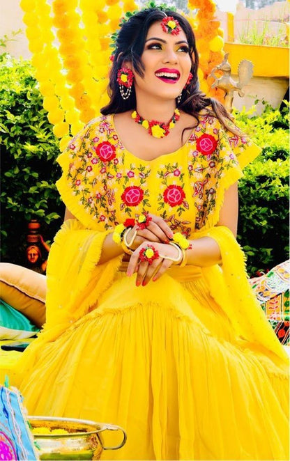 Yellow georgette embroidered ruffle lehenga for haldi ceremony