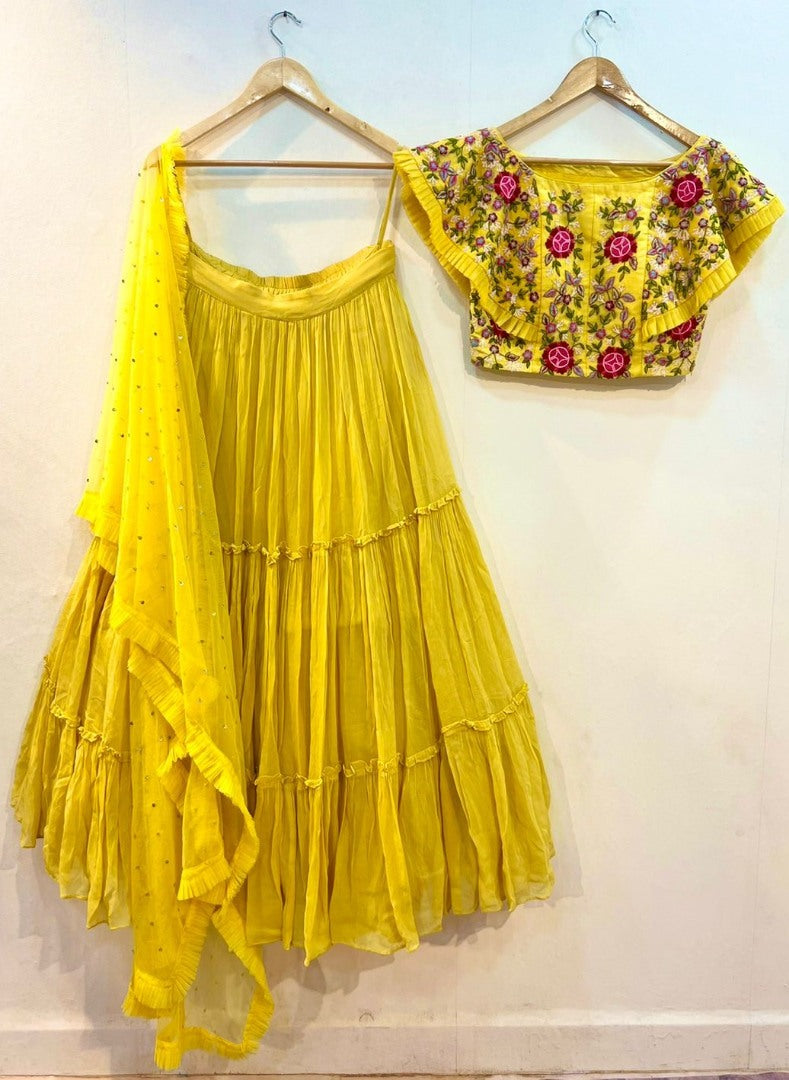 Yellow georgette embroidered ruffle lehenga for haldi ceremony