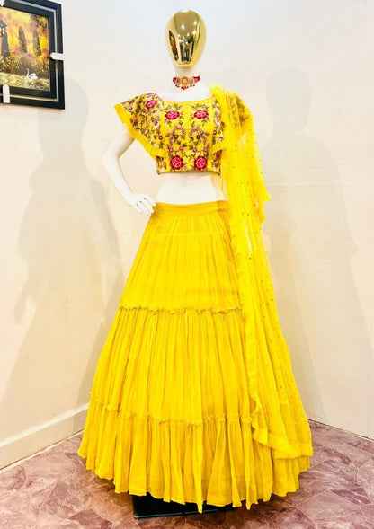 Yellow georgette embroidered ruffle lehenga for haldi ceremony