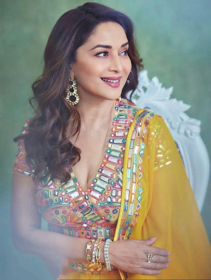 Yellow georgette fancy thread paper mirror work lehenga choli