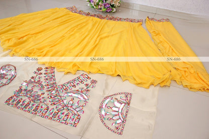 Yellow georgette fancy thread paper mirror work lehenga choli