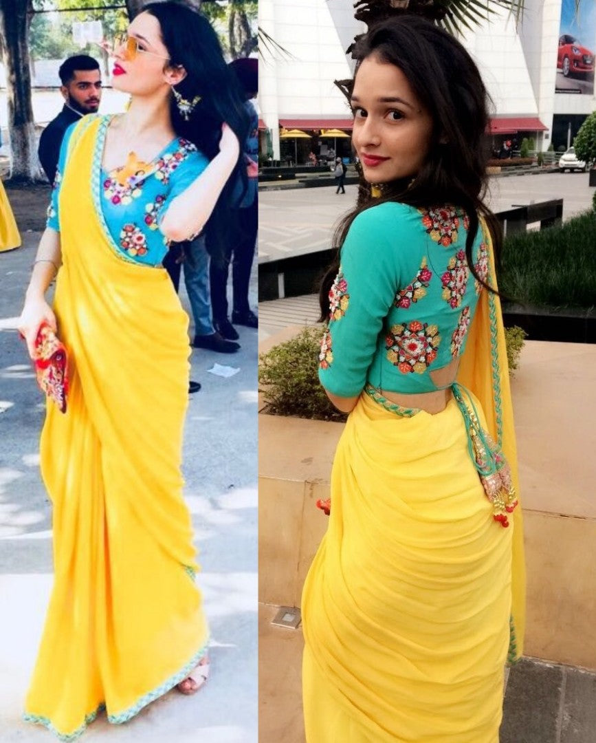 yellow georgette festival wear saree with embroidered blouse