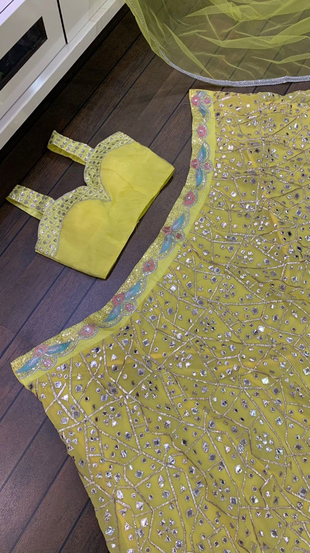 Yellow georgette heavy embroidered foil paper work lehenga choli for haldi ceremony