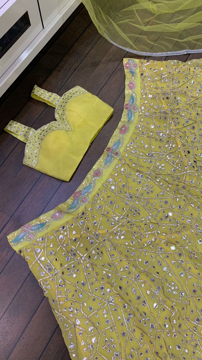 Yellow georgette heavy embroidered foil paper work lehenga choli for haldi ceremony