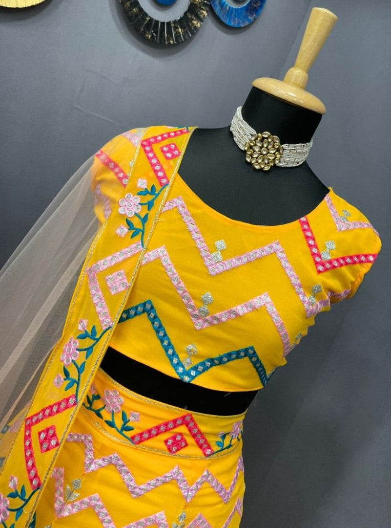 Yellow georgette heavy multi thread embroidered ceremonial lehenga choli