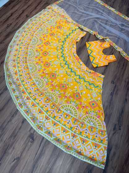 Yellow georgette heavy multi thread embroidered ceremonial lehenga choli