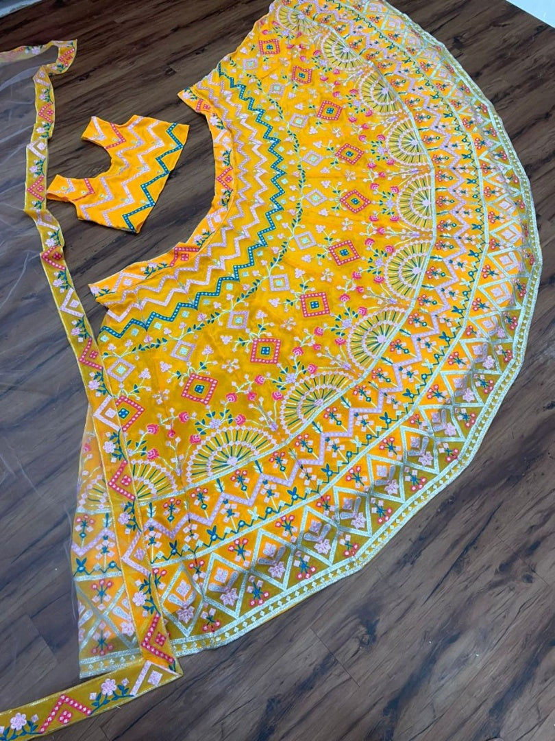 Yellow georgette heavy multi thread embroidered ceremonial lehenga choli