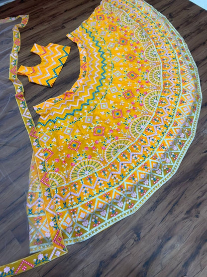 Yellow georgette heavy multi thread embroidered ceremonial lehenga choli