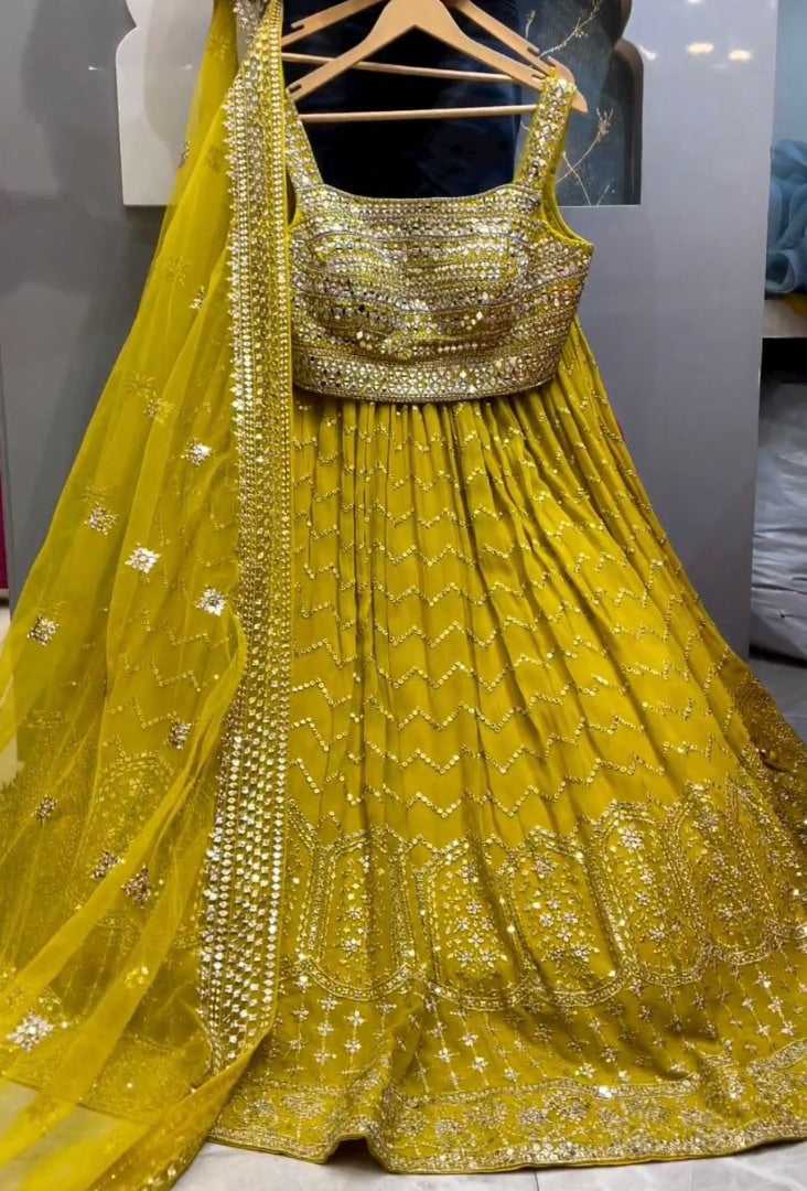Yellow georgette heavy thread sequence work lehenga for haldi ceremony