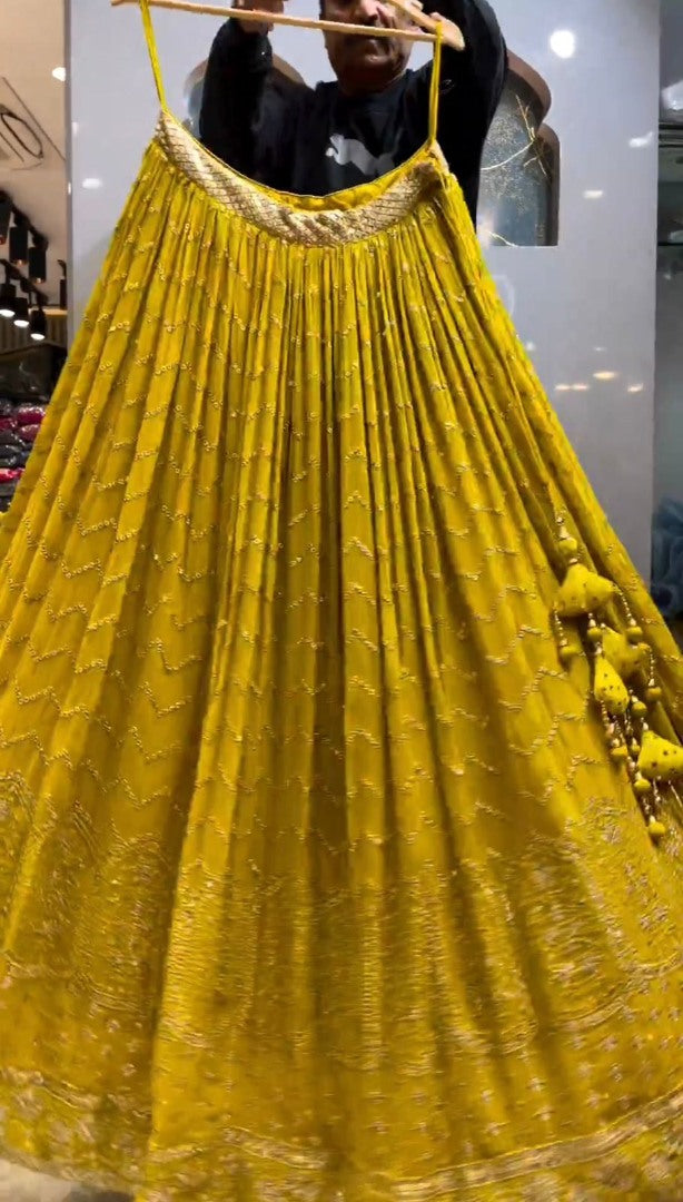 Yellow georgette heavy thread sequence work lehenga for haldi ceremony