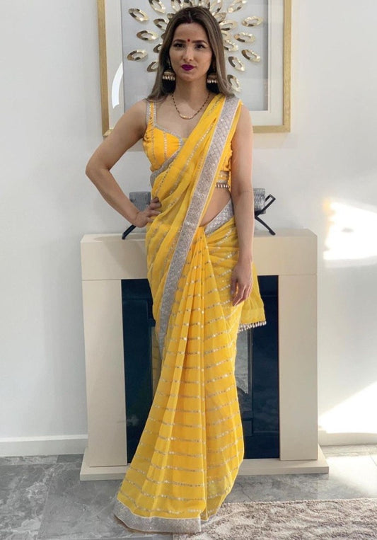 Yellow georgette paper embroidered festival wear saree