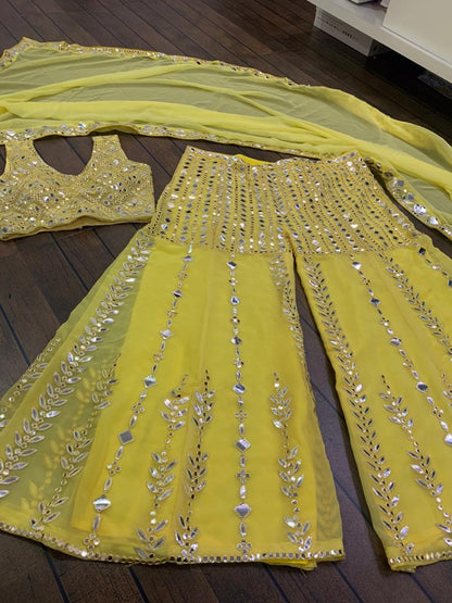 Yellow georgette paper mirror work sharara suit
