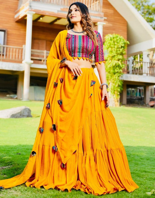 Yellow georgette ruffle layer lehenga with embroidered choli