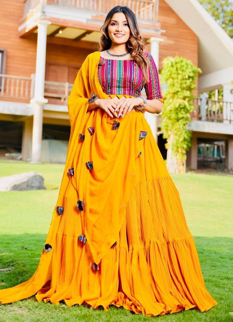 Yellow georgette ruffle layer lehenga with embroidered choli