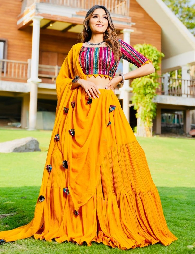 Yellow georgette ruffle layer lehenga with embroidered choli