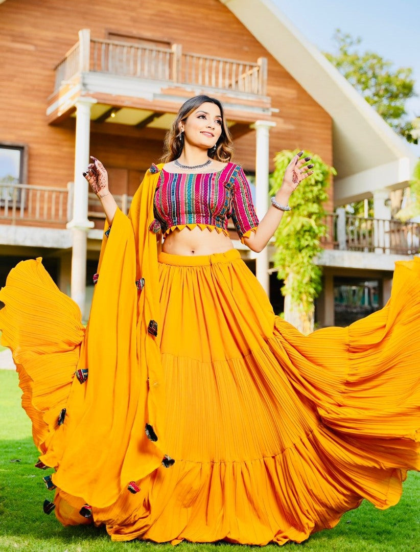 Yellow georgette ruffle layer lehenga with embroidered choli