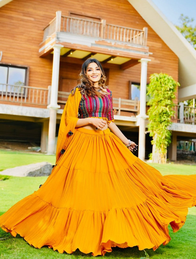 Yellow georgette ruffle layer lehenga with embroidered choli