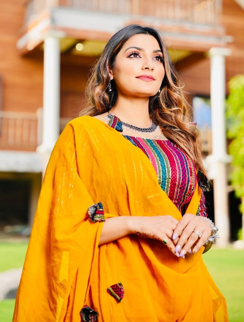 Yellow georgette ruffle layer lehenga with embroidered choli