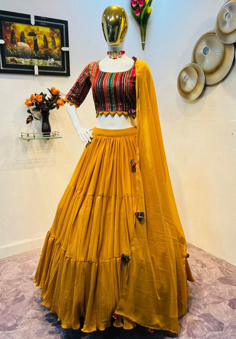 Yellow georgette ruffle layer lehenga with embroidered choli