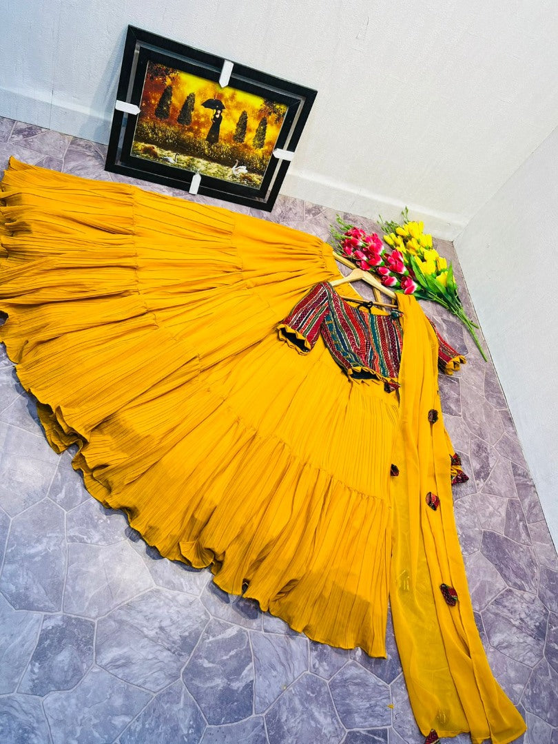 Yellow georgette ruffle layer lehenga with embroidered choli