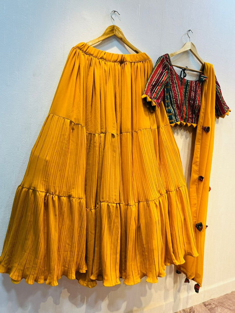 Yellow georgette ruffle layer lehenga with embroidered choli