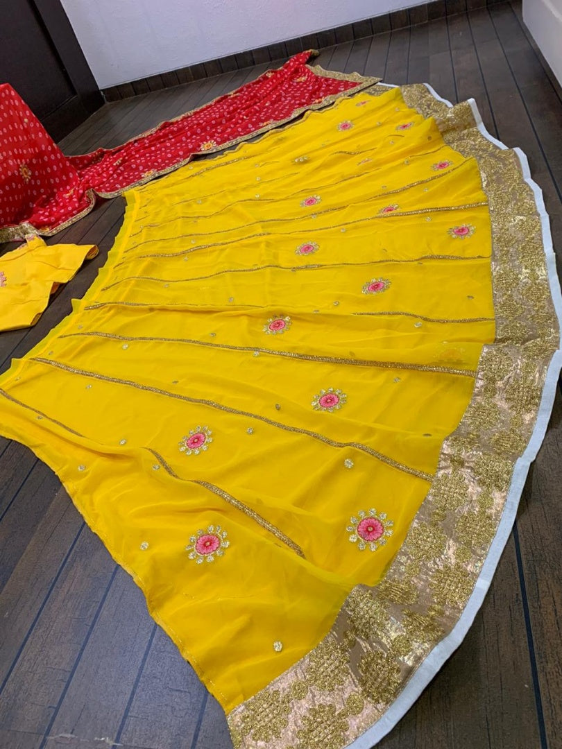 Yellow georgette zari and thread embroidered lehenga choli