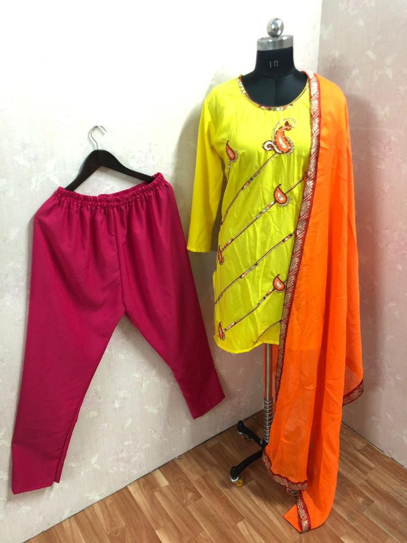 Yellow heavy crepe silk embroidery and mirror work salwar suit