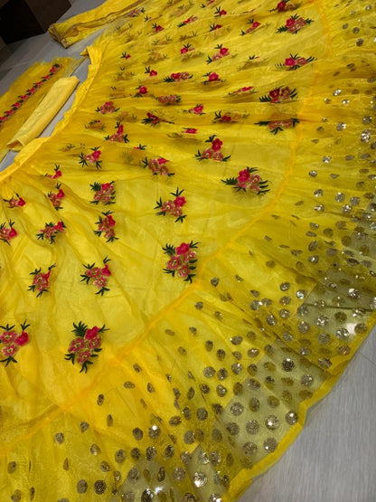 Yellow net embroidered lehenga choli