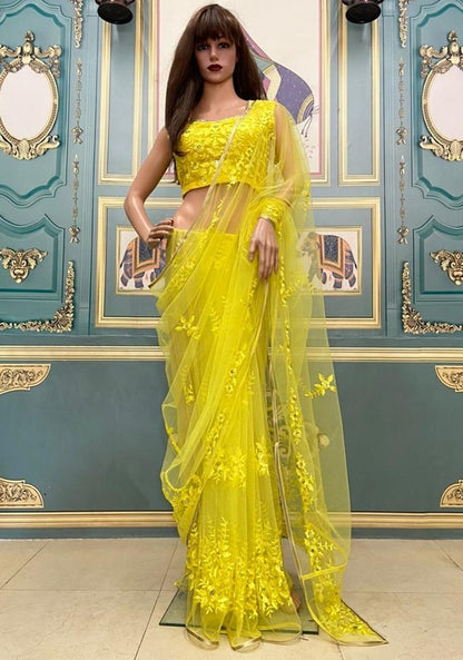 Yellow net embroidered saree