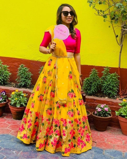 yellow net heavy embroidered wedding lehenga