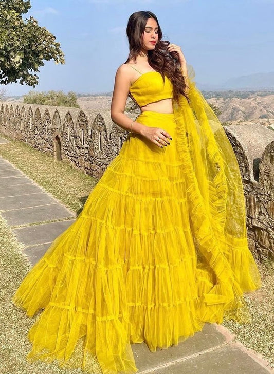 Yellow net ruffle lehenga choli