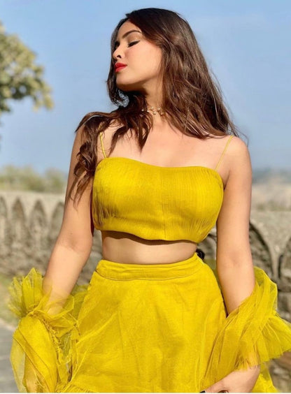 Yellow net ruffle lehenga choli