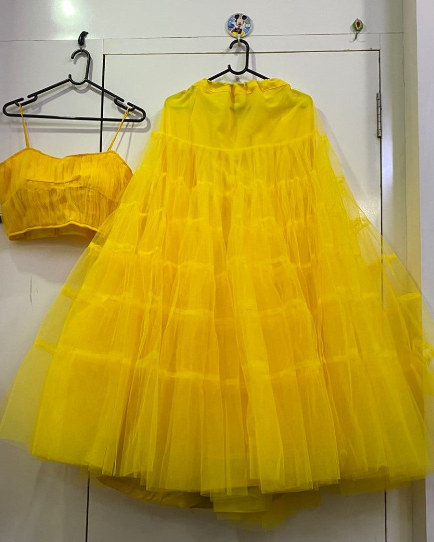 Yellow net ruffle lehenga choli