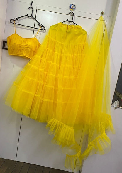 Yellow net ruffle lehenga choli