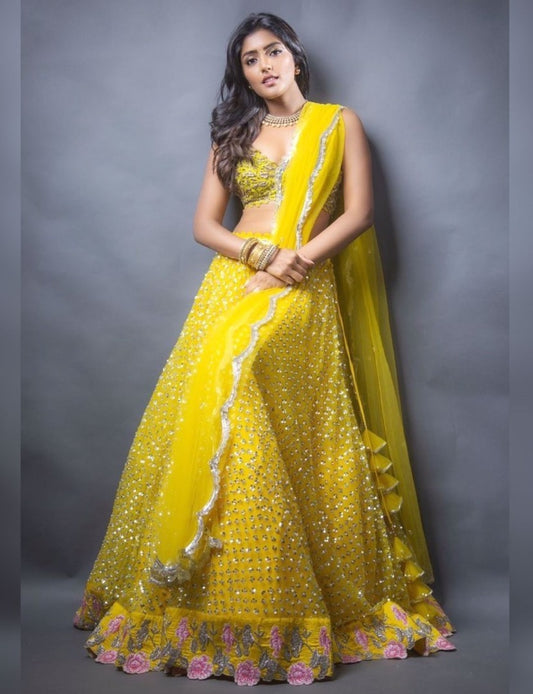 Yellow net sequence and thread embroidered ceremonial lehenga choli