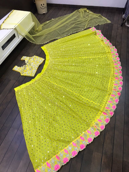 Yellow net sequence and thread embroidered ceremonial lehenga choli