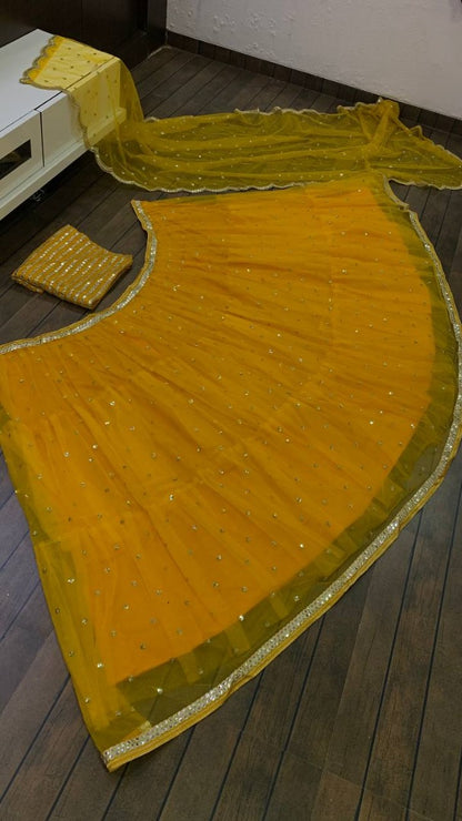 Yellow net sequence embroidery work ruffle lehenga choli for ceremony