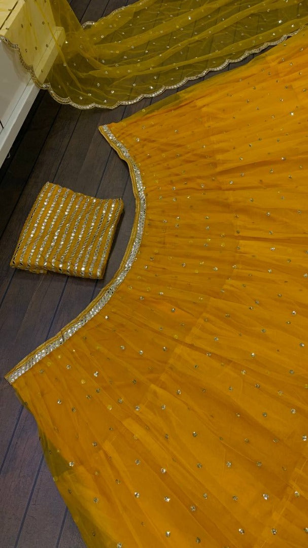 Yellow net sequence embroidery work ruffle lehenga choli for ceremony